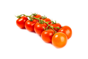 Sprig of cherry tomatoes isolated on white background. Red fresh tomatoes. Fresh vegetables. Vegan. Close-up. Healthy food. Salad Ingredients.