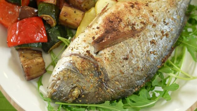 Baked dorado fish with vegetable salsa and grilled vegetables