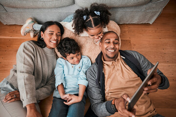 Happy family, children and parents on tablet for selfie, video or movie streaming on internet subscription on living room floor. Home, relax and mom, dad and interracial kids with digital technology