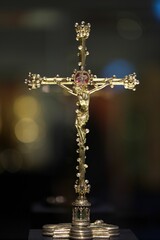 the cross is displayed at the front of the church with its cross made of silver