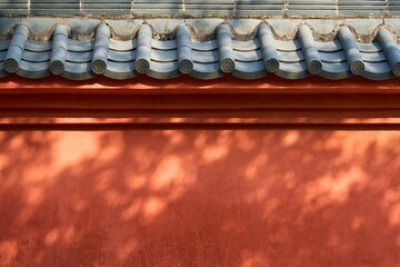 Vibrant red building with a unique tile roof