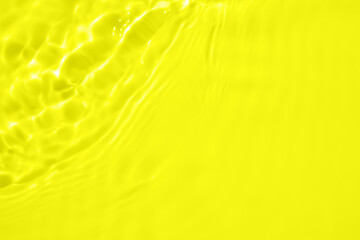 Abstract transparent water shadow surface texture natural ripple on yellow background - obrazy, fototapety, plakaty
