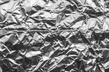 Shiny metal silver gray foil crumpled texture background