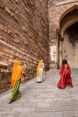 Colorfully dressed women inside Mehrangarh Fort in Jodhpur in Rajasthan, India. The blue city