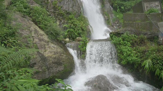 Beautiful Paglajhora waterfall on Kurseong, Himalayan mountains of Darjeeling, West Bengal, India. Origin of Mahananda River flowing through Mahananda Wildlife Sanctuary, Siliguri and Jalpaiguri. 4K.
