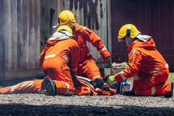 First aid support accident at work. Firefighter to save girl in fire and smoke. Rescue Team or Firefighters save lives people from fire. Firefighter or Emergency team rescue saving life people - obrazy, fototapety, plakaty
