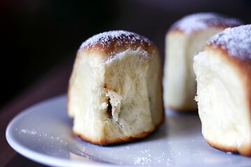 Delicious close-up shot of Austrian Buchteln, a type of sweet roll topped with powdered sugar