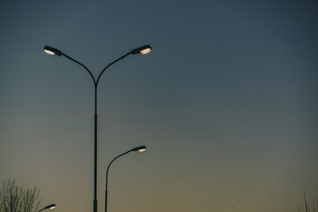 Low angle view of street lights against sky