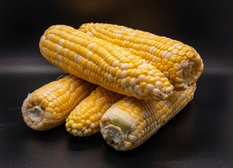 Table Top View of Corn on the Cob, Whit a Black Background, Sitting on the Table