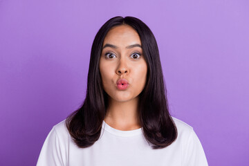 Fototapeta premium Closeup portrait of nice attractive lovely charming woman blow air plump lips sending air kiss isolated on violet color background
