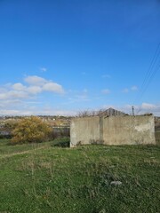 Fototapeta na wymiar A cement wall in a field