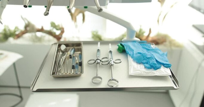 A set of dentist's tools prepared for the procedure. Dental hygiene and health conceptual images
