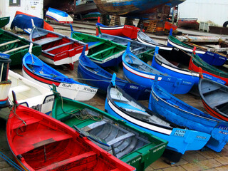 Sesimbra, Portugal. Traditional fishing boats, called Aiolas at the fishing harbor of Sesimbra, Setubal District