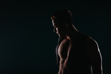 A silhouette of a fit athlete flexing muscles, inspiring with body transformation results and motivating others.