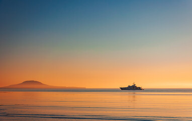 Silhouette of a luxurious yacht on the sea of cortez  at sunset