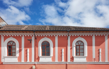 Street view of an old colonial building facade in Quito, Ecuador.