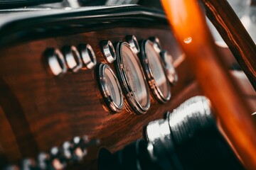 an old fashioned wooden dashboard with the gauges on it - obrazy, fototapety, plakaty