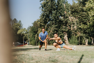 Naklejka premium Active Couple Training in a Sunny Park, Motivation and Fitness Outdoors