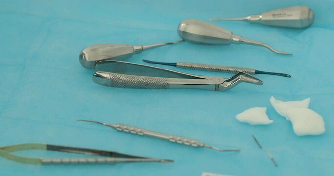 A set of dentist's tools prepared for the procedure. Dental hygiene and health conceptual images