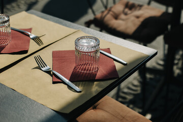 Table served for lunch in a street cafe on a sunny day.