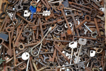 Texture in flat lay angle of old and rusty keys at the antiques market