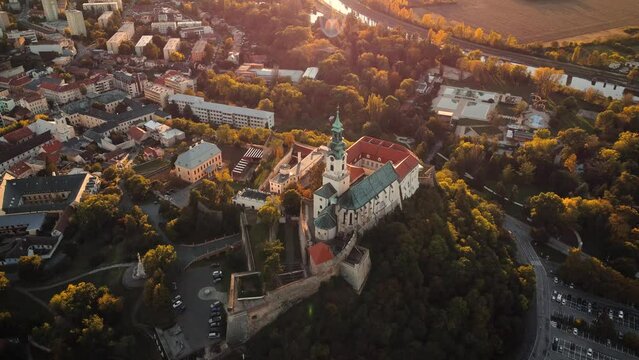 4k footage of Nitra Castle and streets of Nitra city on sunset - autumn time. Aerial view of beautiful and fairytale Nitra Castle.