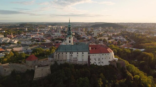 4k footage of Nitra Castle and streets of Nitra city on sunset - autumn time. Aerial view of beautiful and fairytale Nitra Castle.