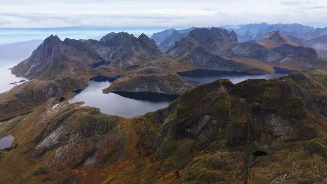 Above the Fjords: Aerial Perspective from a Hill in Lofoten, Norway, with Enchanting Ocean and Towering Peaks