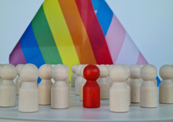 People protecting inclusion text and LGBT flag