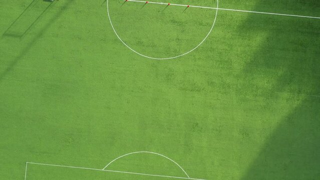 Soccer field with green grass. Aerial top view from drone