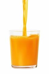 Freshly squeezed orange juice being poured into a transparent glass on a white background