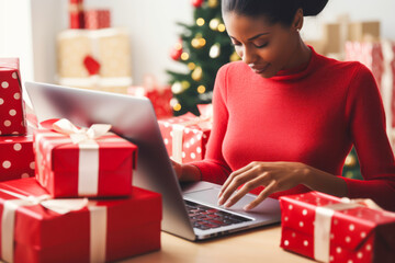 Fototapeta na wymiar Woman comparing Christmas gift prices online on laptop