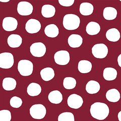 All over seamless repeat pattern with hand drawn irregular white polka dot on deep burgundy maroon. Traditional trendy modern xmas background with tossed dots