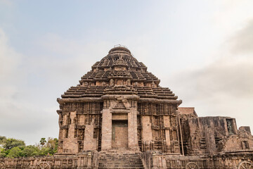 Fototapeta na wymiar Ancient Indian architecture Konark Sun Temple in Odisha, India. This historic temple was built in 13th century. This temple is an world heritage site.