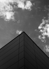 Low angle shot of a modern building corner in grayscale