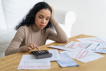 Stressed young woman has financial problems with credit card debt to pay crucial show concept of...