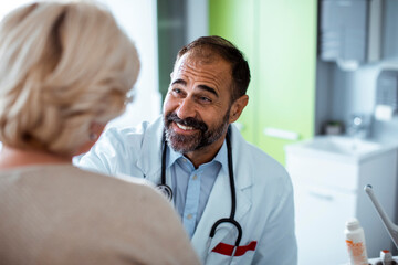 Doctor talking to a senior patient in the hospital