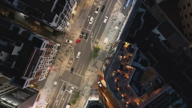 Establishing aerial view of Madrid Gran Via historic buildings architecture and cars driving on the road at night, Madrid Spain tourism attractions