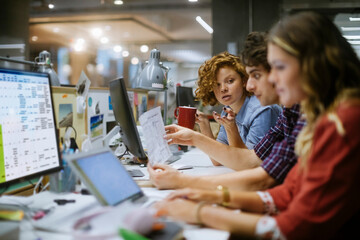 Young business people going over documents in the office