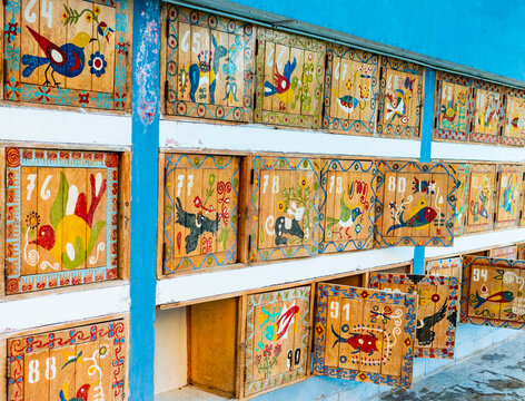 Colorful lockers at La Calera thermal waters, painted with traditional motifs and indigenous animals that populate the valley, Chivay, Peru
