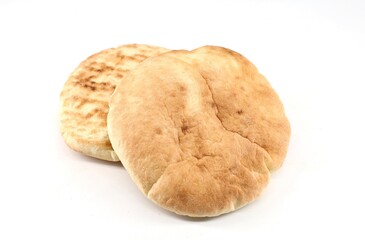 Puccia bread on white background. It is traditional italian food from Puglia with round shape used...
