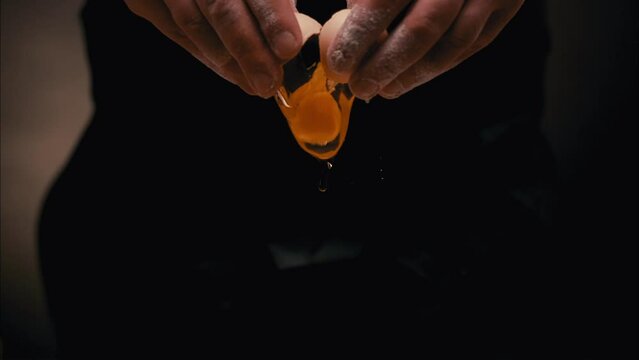 Egg Breaking by Hands into the Flour