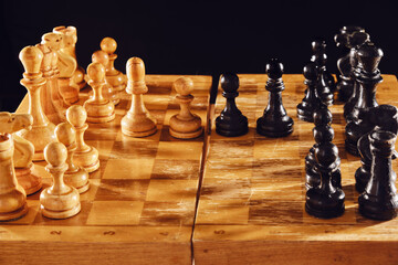 Old chess game with a French defense debut on a black background