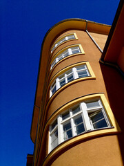 Low angle view of modern apartment building in Berlin against clear blue sky