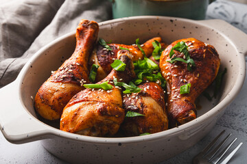 Chicken drumsticks with sesame seeds and rice, Asian cooked chicken close up