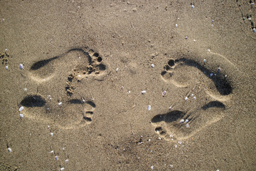 Photographic documentation human footprints in the sand