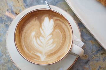 latte art coffee on tiles background