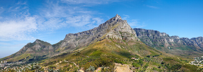 Panoramic landscape view of the majestic Table Mountain, Cape Town, South Africa. Beautiful scenery of a popular tourist attraction, destination and national landmark with cloudy blue sky copy space