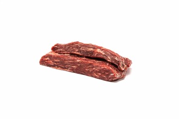 Isolated image of raw beef steak stacked on top of one another in a pile