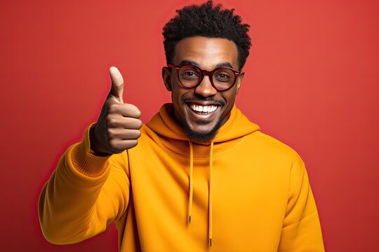 A young black man smiles and gives a thumbs up as an OK symbol. Generated by AI.